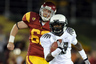 LOS ANGELES CA - OCTOBER 30:  Cliff Harris #13 of the Oregon Ducks runs past Chris Pousson #62 of the USC Trojans during the second quarter at Los Angeles Memorial Coliseum on October 30 2010 in Los Angeles California.  (Photo by Harry How/Getty Images)