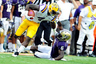 BATON ROUGE, LA - SEPTEMBER 08: Desmond Trufant #6 of the Washington Huskies attempts to tackle Alfred Blue #4 of the LSU Tigers during a game at Tiger Stadium on September 8, 2025 in Baton Rouge, Louisiana. (Photo by Stacy Revere/Getty Images)